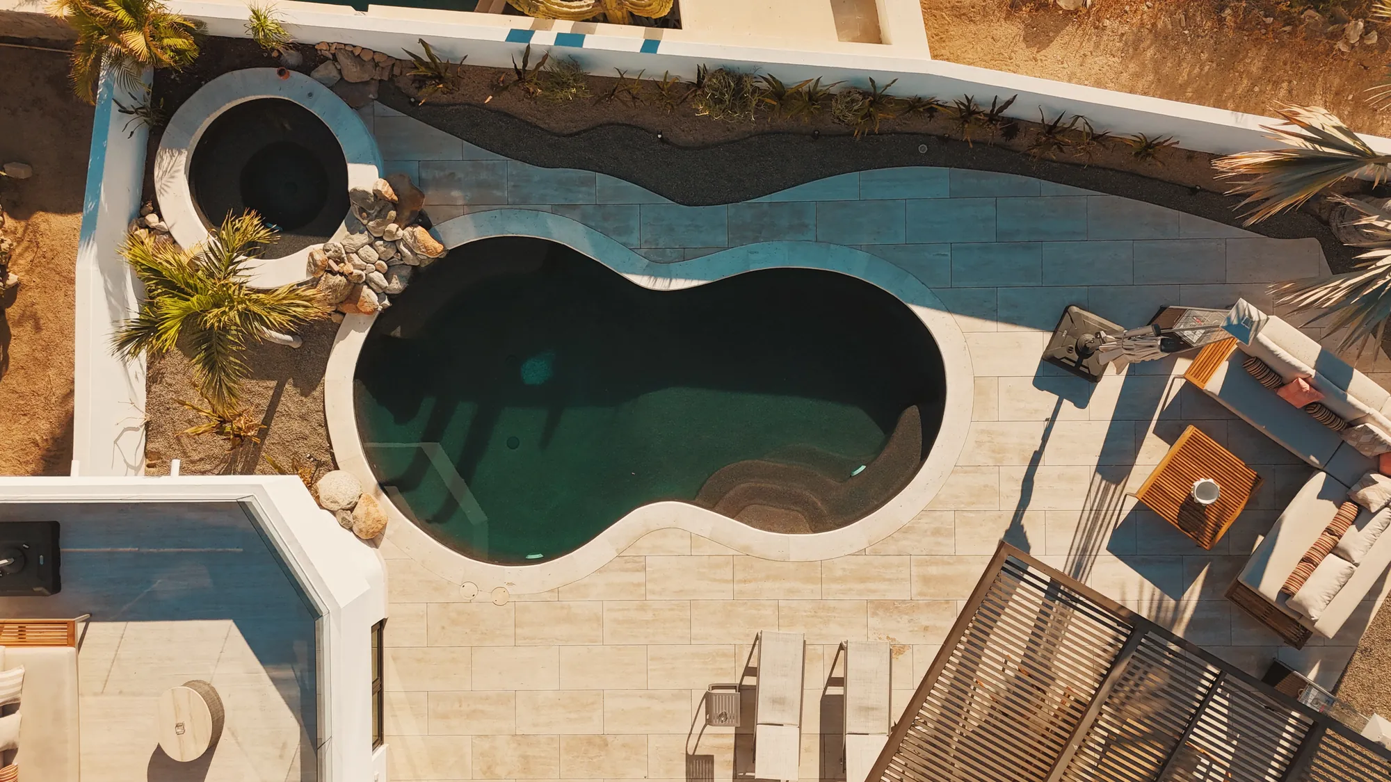 Top-down view of the villa pool and terraces