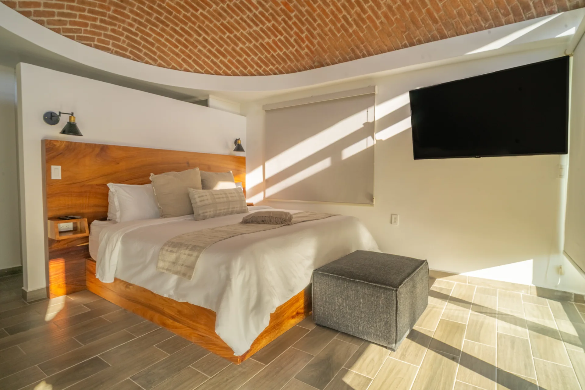 Primary bedroom with wood details and natural light